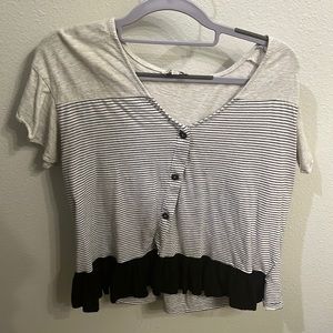 Cute blouse with buttons and ruffled bottom